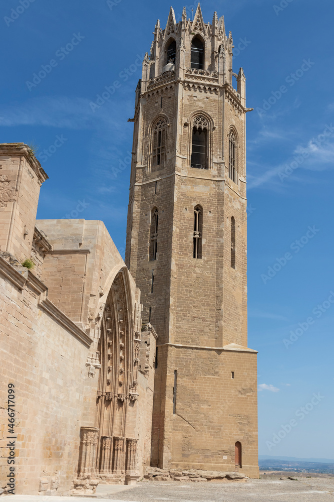 facade and tower of the cathedral of lerida with a blue sky a hot summer day