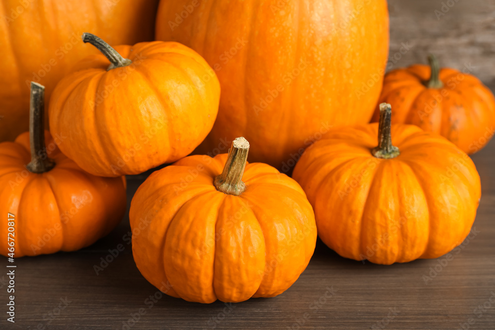 Fresh ripe pumpkins on wooden table, closeup Fresh ripe pumpkins on wooden table, closeup