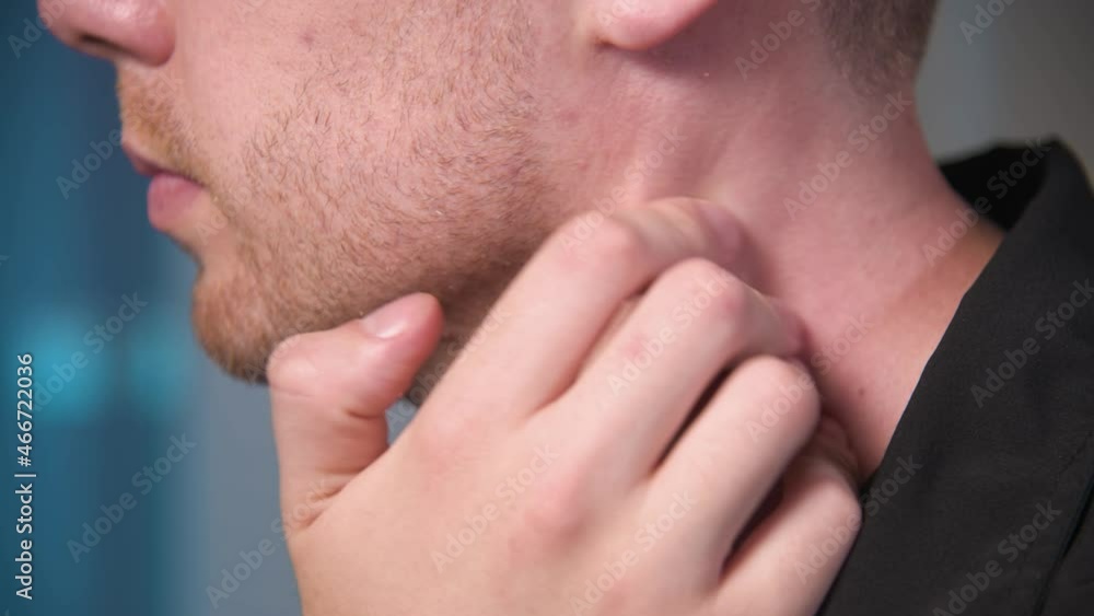 Close-up of a Caucasian man doing a neck massage to himself. neck pain and prevention of neck problems. Close-up of a Caucasian man doing a neck massage to himself. neck pain and prevention of neck problems.