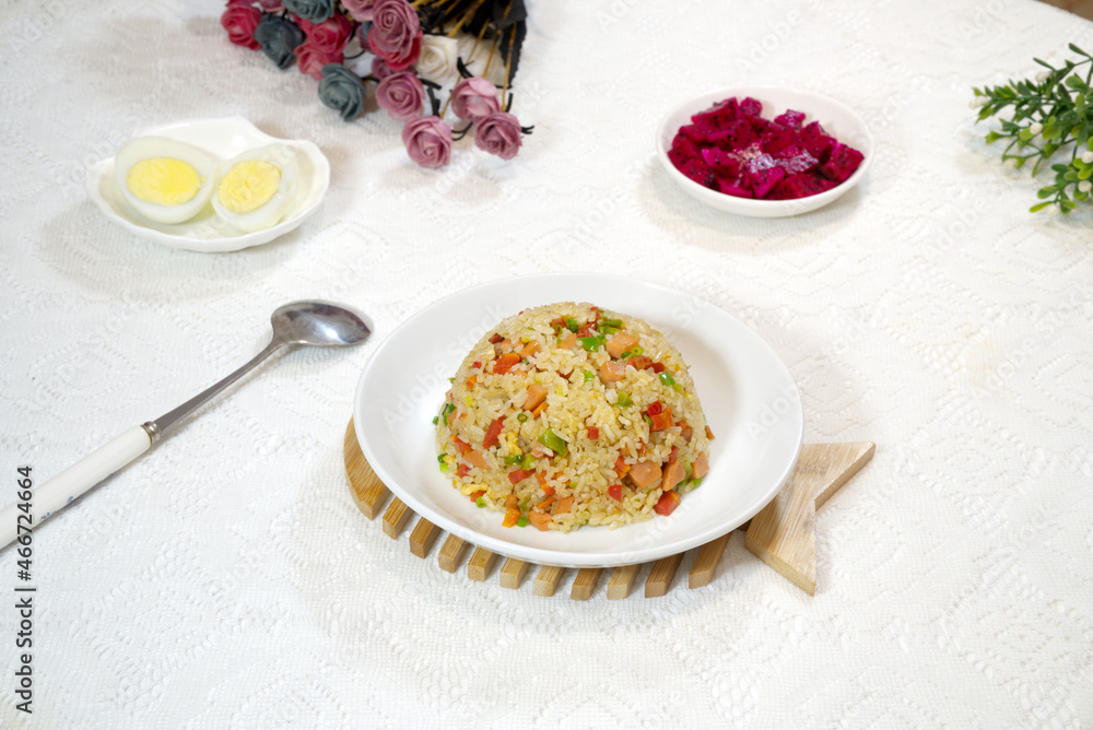 Yangzhou fried rice, egg, pitaya, a spoon, red rose
