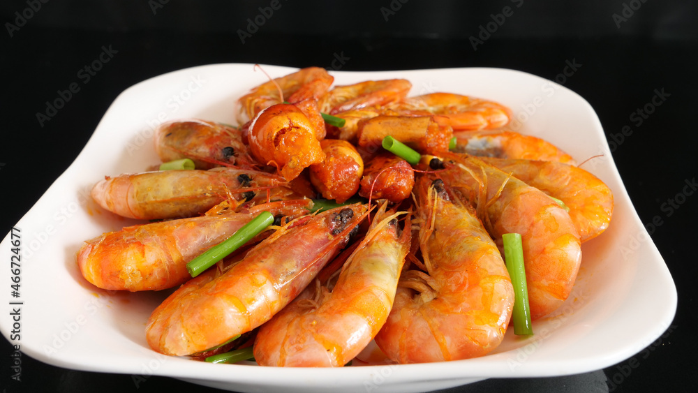 Close-up golden oil stuffed prawns on the black table, delicious seafood Close-up golden oil stuffed prawns on the black table, delicious seafood