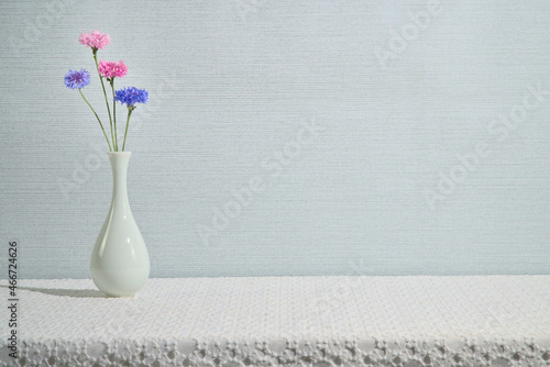 Fototapeta Naklejka Na Ścianę i Meble -  A beautiful flower on a white table, copy space