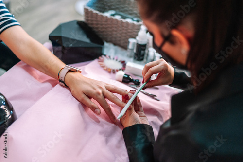 Woman having a manicure at beauty salon