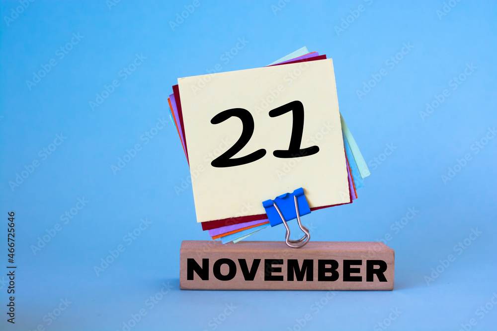 November 21st. Day 21 of November month, calendar on workplace with blue background. Autumn time. Empty space for text November 21st. Day 21 of November month, calendar on workplace with blue background. Autumn time. Empty space for text