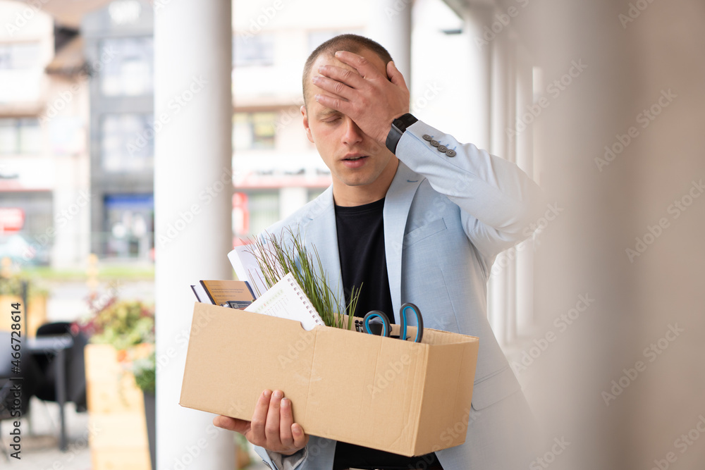 Portrait of a young man who lost his job. He doesn't know what to do, he is stressed. Unemployment rate growing. Portrait of a young man who lost his job. He doesn't know what to do, he is stressed. Unemployment rate growing.