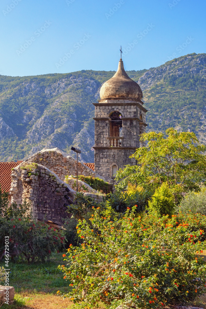 Religious architecture. Montenegro, Old Town of Kotor - UNESCO World Heritage site.  Bell tower of church of Saint Clare on sunny autumn day, view from Town Wall
