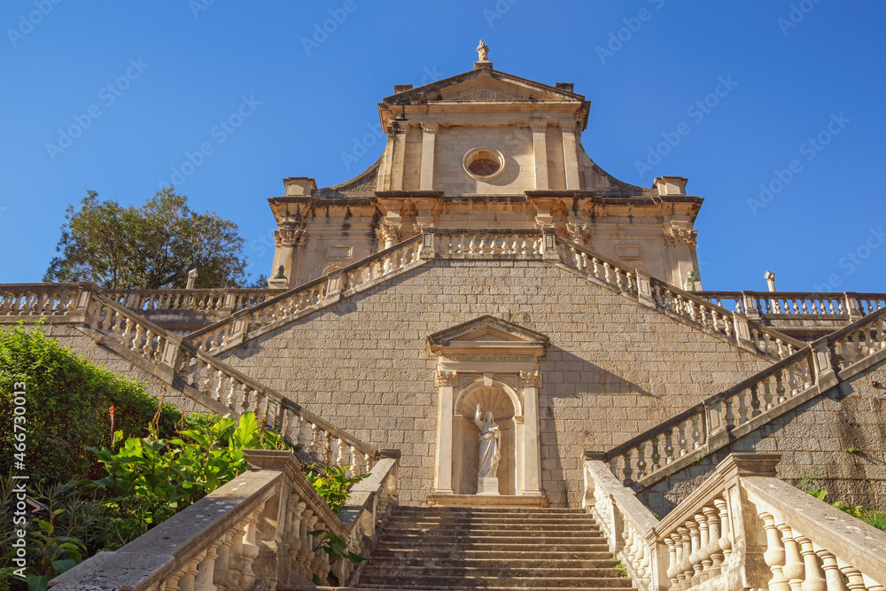 Religious architecture. Venetian baroque. Montenegro, Prcanj town ( Kotor ). View of ancient Catholic church of Birth of Our Lady on sunny autumn day Religious architecture. Venetian baroque. Montenegro, Prcanj town ( Kotor ). View of ancient Catholic church of Birth of Our Lady on sunny autumn day