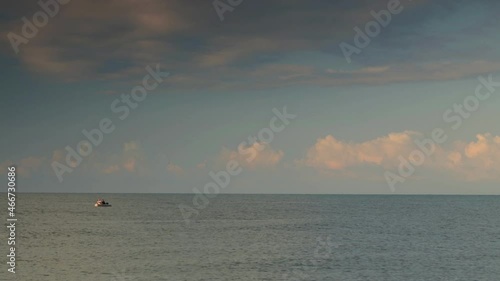 Wallpaper Mural A fishing boat sails across the sea along the horizon Torontodigital.ca