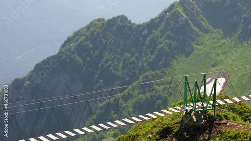 Wallpaper Mural Suspension bridge over the precipice in the mountains between the rocks Torontodigital.ca