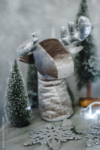 Fototapeta Naklejka Na Ścianę i Meble -  New Year's soft deer figure close-up