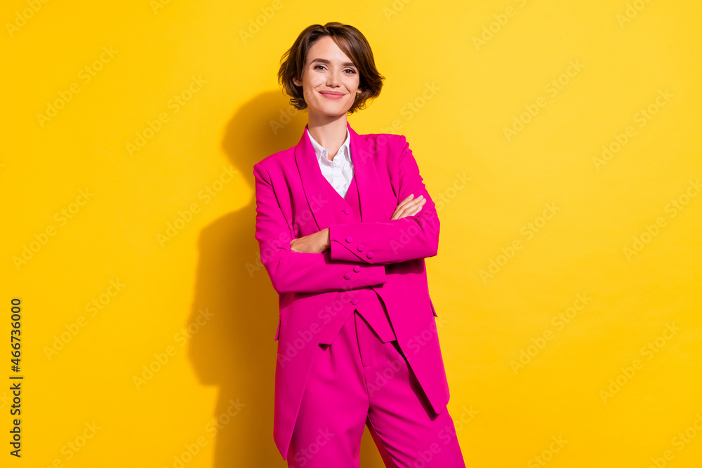 Photo of cool young brunette lady crossed arms wear pink blazer isolated on yellow color background Photo of cool young brunette lady crossed arms wear pink blazer isolated on yellow color background