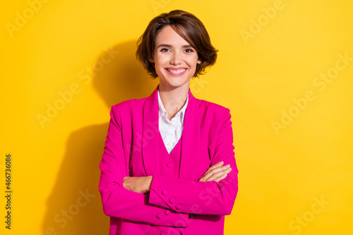 Photo of nice millennial brunette lady crossed arms wear pink blazer isolated on yellow color background