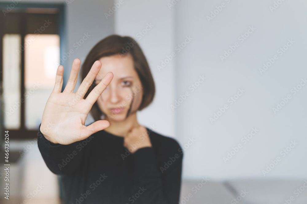 Young Female Crying And Showing Stop Sign. Concept Of Violence Against Women. Sexual And Gender-Based Violence. Soft focus Young Female Crying And Showing Stop Sign. Concept Of Violence Against Women. Sexual And Gender-Based Violence. Soft focus