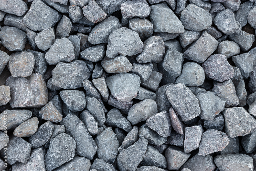 Granite crushed stone or graphy. Building material texture background. Granite crushed stone or graphy. Building material texture background.