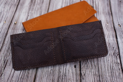 Brown unisex leather wallet. Handmade products made of genuine soft leather. Wallet for money and cards. Open Wallet photo