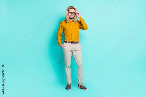 Full size photo of young handsome man happy positive smile confident eyeglasses isolated over turquoise color background