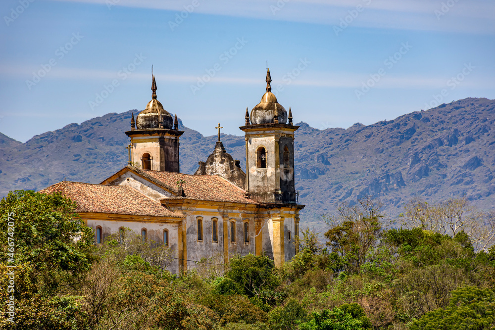 View from behind an old colonial-style church in the historic city of Ouro Preto in Minas Gerais and its mountains