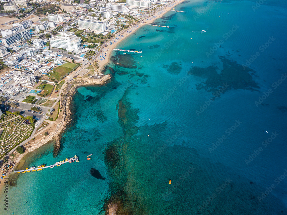 Aerial view of resort town with blue sea