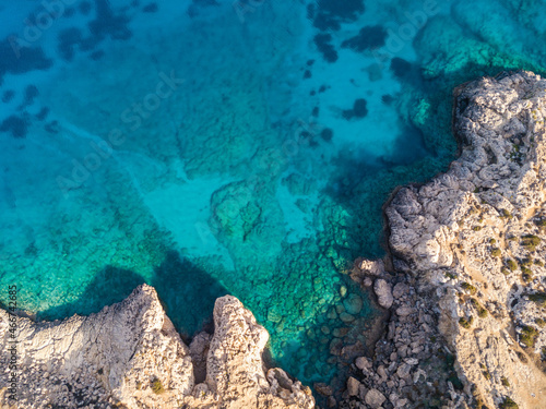 Aerial view of cliffs by the azure sea