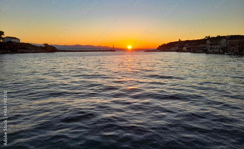 sunrise at gaios harbour paxos greek island   sun reflection on sea