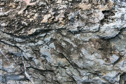 Huge Cracks And Layers. Coarse, Rough Gray Stone, Rock Texture Of Mountains Background