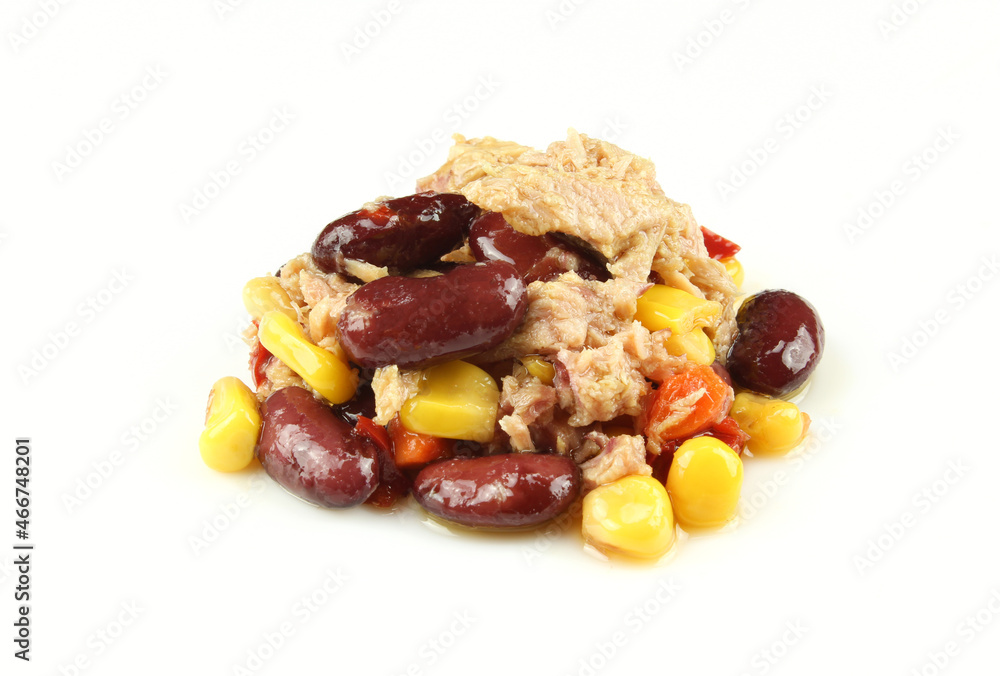 Pile of mexican tuna salad isolated on white background. Fish,corn,beans, chilli paprika etc. Pile of mexican tuna salad isolated on white background. Fish,corn,beans, chilli paprika etc.