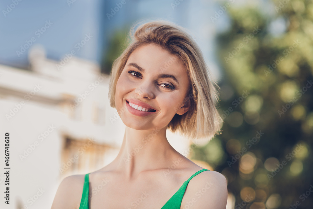 Photo of cute charming young lady wear green clothes walking smiling outside urban city street Photo of cute charming young lady wear green clothes walking smiling outside urban city street