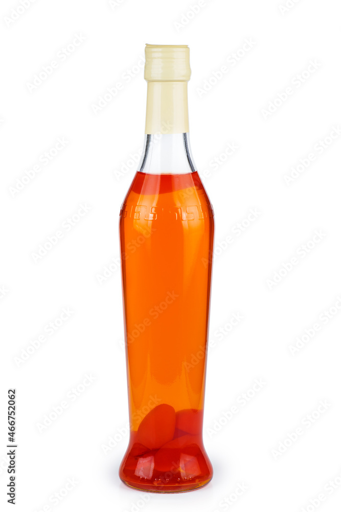 Kumquat liqueur isolated on a white background Kumquat liqueur isolated on a white background
