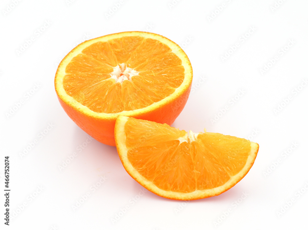 halved orange and green leaves isolated on white background halved orange and green leaves isolated on white background