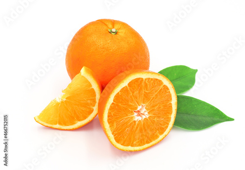 halved orange and green leaves isolated on white background