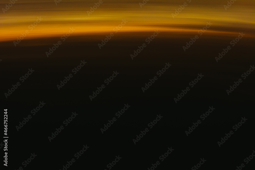 Abstract orange sunset on the dark horizon. Beautiful background. Abstract orange sunset on the dark horizon. Beautiful background.