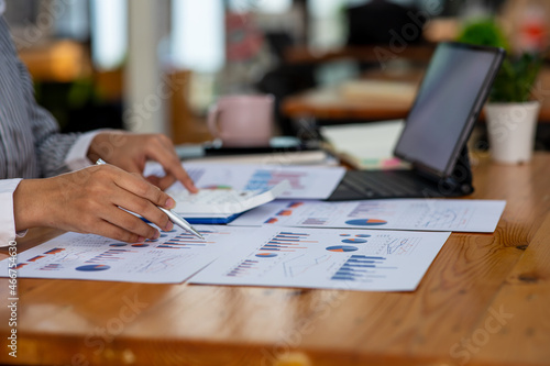 Businesswoman's hands hold documents with financial statistic stock photo, discussion and analysis data the charts and graphs. Finance concept