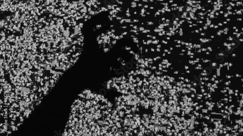 Night terror. Old horror movie. Social media anxiety. Haunted screen. Spooky monster hands silhouette scratching frightening on analog VHS glitch black white flicker noise TV background. photo