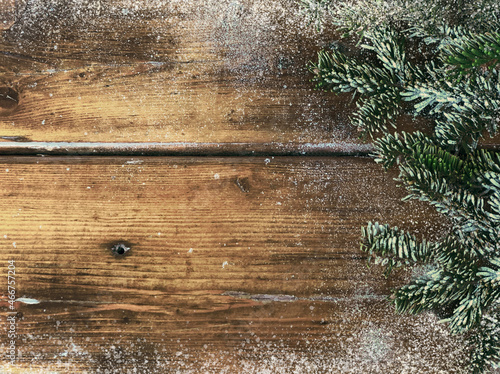 Christmas background from planks and spruce branches.