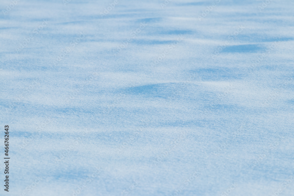 Wavy ground surface covered with snow, snow texture, winter background Wavy ground surface covered with snow, snow texture, winter background