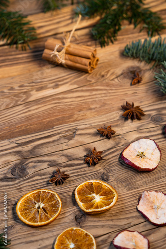 Traditional Czech Christmas on wood decoration with twig, apple, orange, fruit