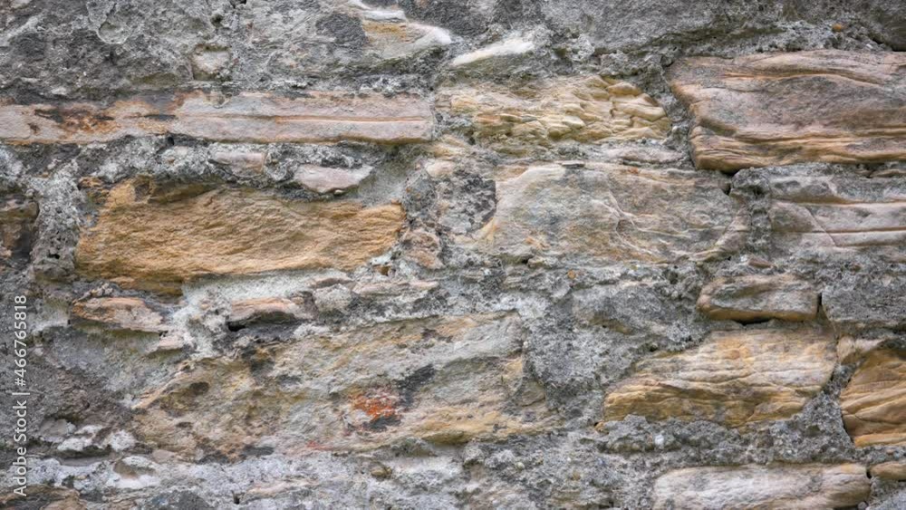 Medieval wall facade of stones and bricks. Texture material background. Medieval wall facade of stones and bricks. Texture material background.
