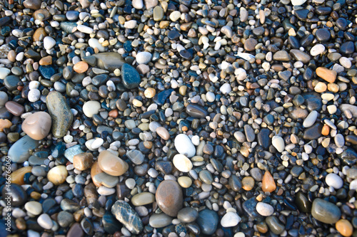 Φωτογραφία Wet pebblestone background on sea shore