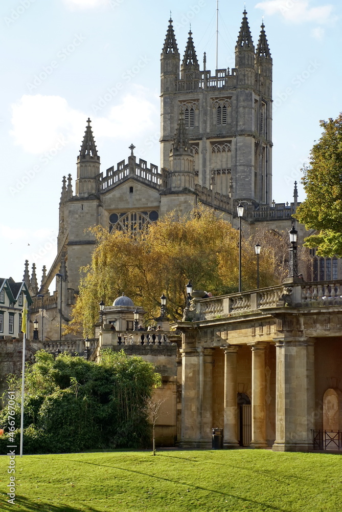 Bath Abbey and Georgian architecture, surrounded by autumn foliage, in Bath, England