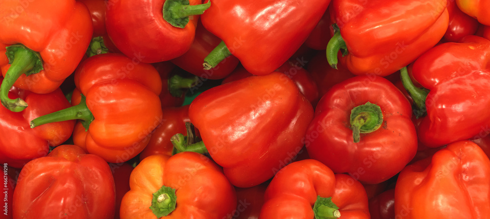 A lot of red bell pepper, texture background. Pile of fresh ripe red bulgarian pepper pattern, high quality photo A lot of red bell pepper, texture background. Pile of fresh ripe red bulgarian pepper pattern, high quality photo