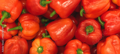 A lot of red bell pepper, texture background. Pile of fresh ripe red bulgarian pepper pattern, high quality photo