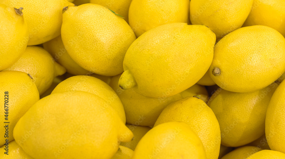 A lot of golden lemon, texture background. Pile of fresh ripe lemon pattern, high quality photo A lot of golden lemon, texture background. Pile of fresh ripe lemon pattern, high quality photo