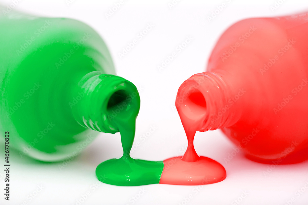 Set of multi-colored nail polish on a white background. Long banner. Manicure and pedicure selection of any colors. Liquid flows from the vial. Set of multi-colored nail polish on a white background. Long banner. Manicure and pedicure selection of any colors. Liquid flows from the vial.