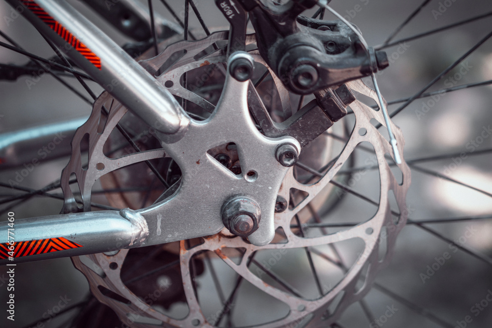 Bicycle elements in close-up. Individual parts of a sports bike are in focus. The vehicle parts are covered with dust Bicycle elements in close-up. Individual parts of a sports bike are in focus. The vehicle parts are covered with dust