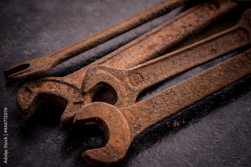 Old rusty wrenches on a dark background Old rusty wrenches on a dark background