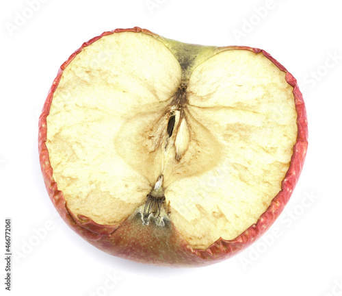 Half of a spoiled apple on a white background