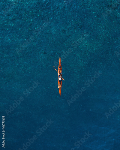 Aerial view of a thin canoe, Roccalumera, Sicily. photo