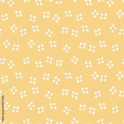 Orange seamless pattern with white dots.