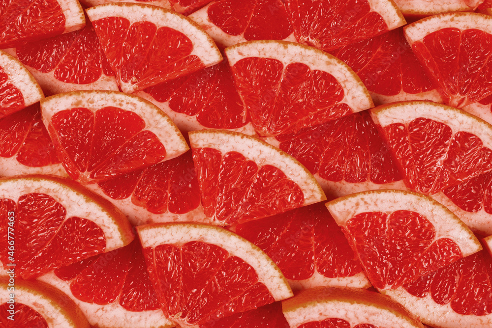 Grapefruit red juicy slices background. top view. Grapefruit red juicy slices background. top view.