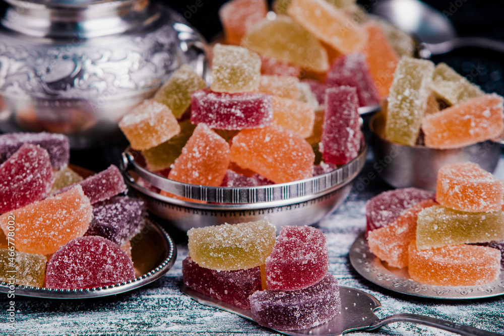 Dessert marmalade in the form of lemon and orange slices. The sweetness of jelly candy. Dessert marmalade in the form of lemon and orange slices. The sweetness of jelly candy.